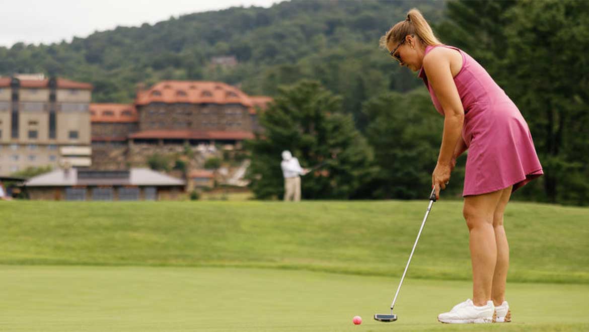 Woman golfing