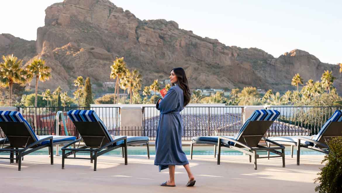 Woman walking on spa deck.
